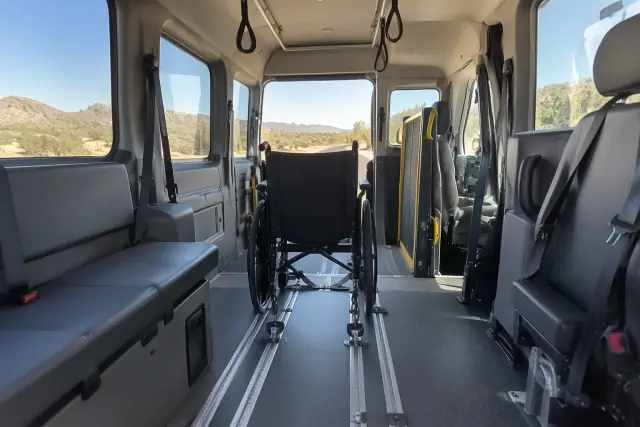 Padded interior of a medical transport van with secure floor tracks in Fountain Hills, AZ.