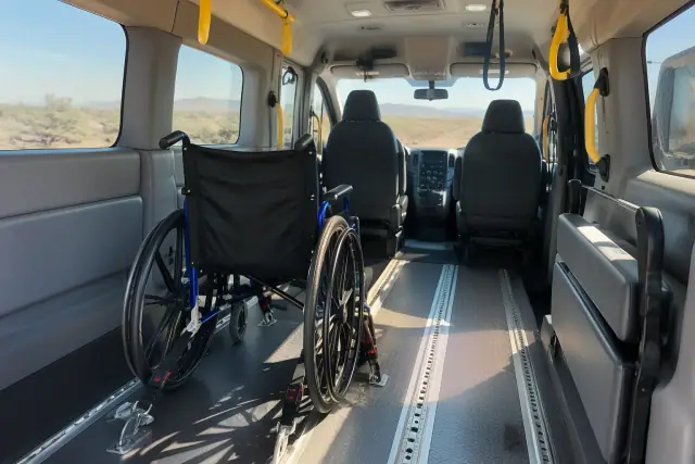 Padded medical transport van interior with secure floor tracks in Chandler, AZ.