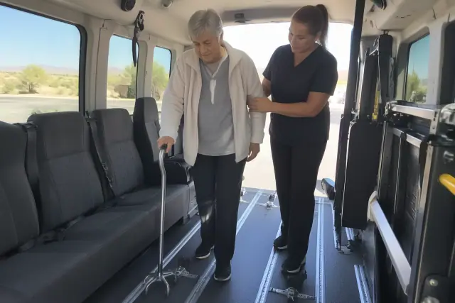 Padded interior of a medical transport van with floor tracks and grab handles in Sun Lakes, AZ.