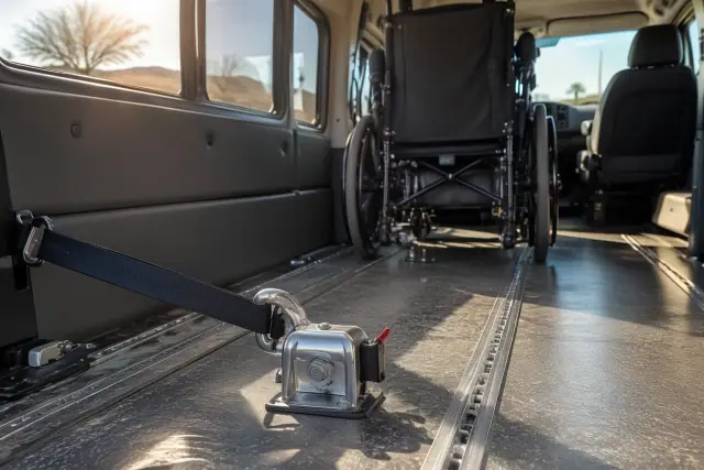 Heavy-duty wheelchair anchor on a transport van floor in Gilbert, AZ.