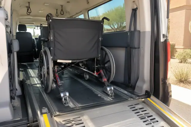 Bariatric transportation secured on floor tracks inside a medical van in Queen Creek, AZ.