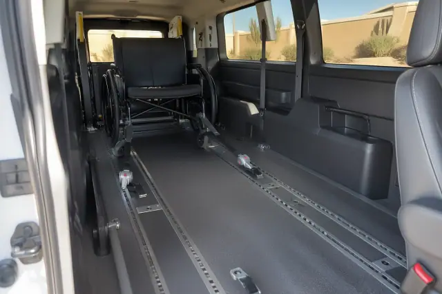 Bariatric transportation van interior with heavy-duty floor anchor tracks in Mesa, AZ.