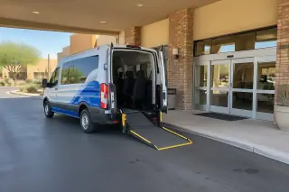 Accessible medical transport van with a deployed loading ramp in Mesa, AZ.