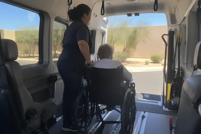 Interior of a transport van with floor tracks and grab handles during hospital discharge transportation in Mesa, AZ.