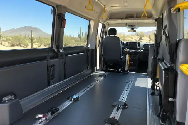 Padded interior of a medical transport van with floor tracks in Scottsdale, AZ.