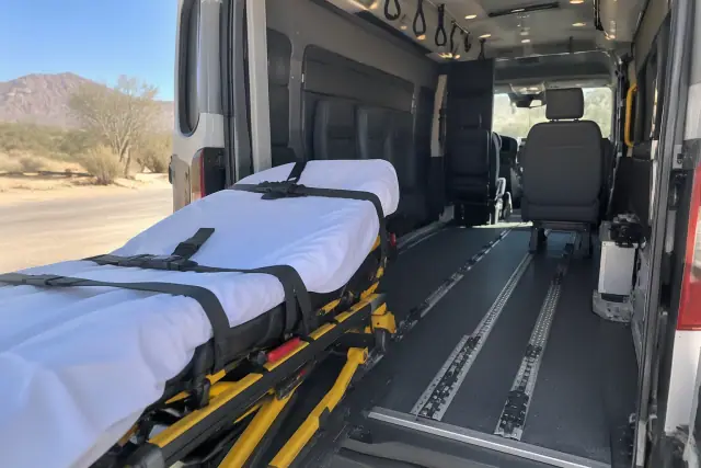 Loading gear for long-distance medical transportation on concrete in Gold Canyon, AZ.
