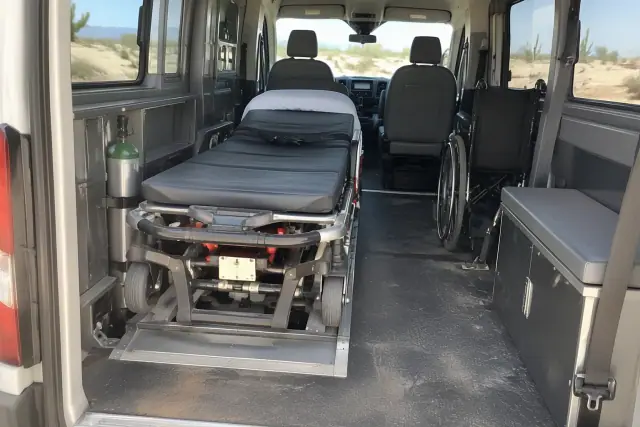 Medical transport van interior cabin in Mesa, AZ, with desert sunlight reflecting off the glass.