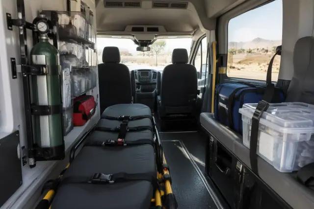 Organized supply cases and secure mounting brackets inside a transport van cabin in Mesa, AZ.