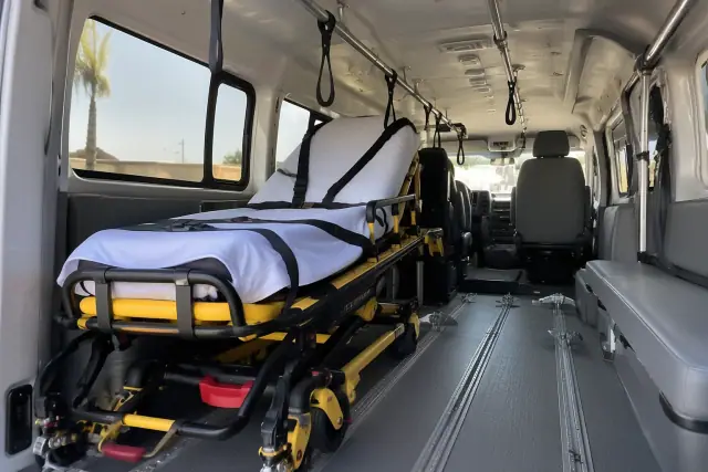 Secured stretcher setup for dialysis transportation inside a transport van in Mesa, AZ.