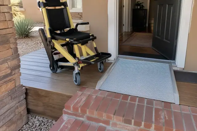 Mobility assist device with locked casters on a wooden porch in Mesa, AZ.