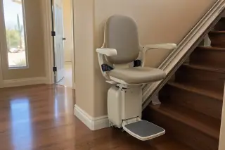 Stair chair transportation project detail in a hallway with stucco walls in Mesa, AZ.