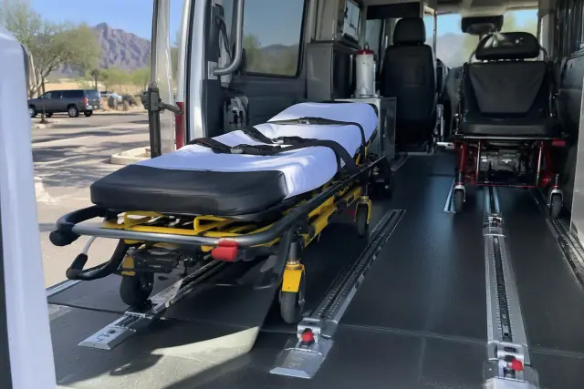 Standard stretcher and gurney transport secured in a vehicle in Mesa, AZ.