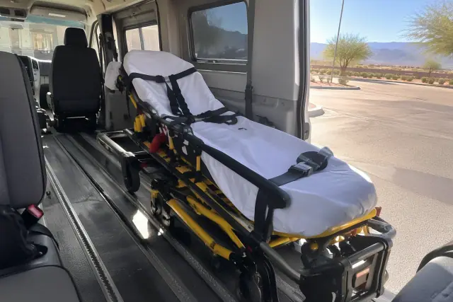 Stretcher and gurney secured inside a transport van in Mesa, AZ.
