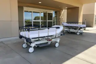 Wide view of a stretcher and gurney transport vehicle project at a hospital bay in Mesa, AZ.