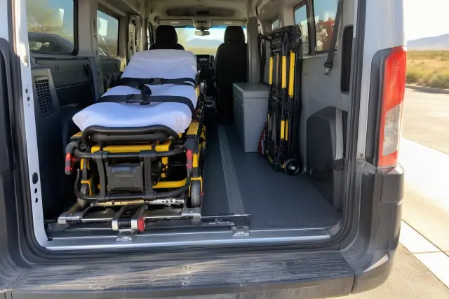 Stretcher travel and positioning secured inside a transport van in Mesa, AZ.
