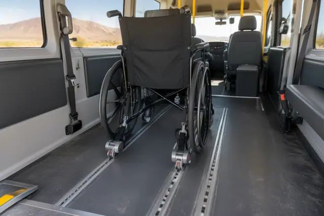 Wheelchair securement tracks inside a medical transport van in Mesa, AZ.