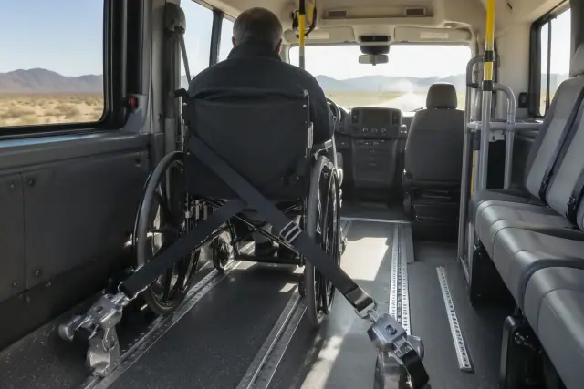 Padded vehicle interior with floor tracks and wheelchair securement equipment in Sun Lakes, AZ.