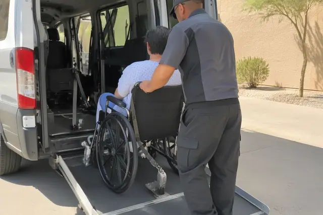 Wheelchair transportation vehicle interior showing a floor restraint anchor bracket in Tempe, AZ.