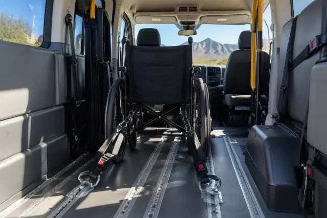 Wheelchair securement tracks inside a medical transport van in Apache Junction, AZ.