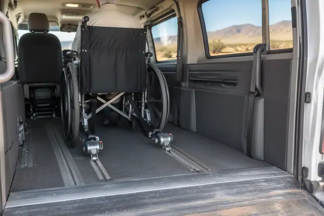 Padded interior of a wheelchair transport van with secure floor tracks in San Tan Valley, AZ.