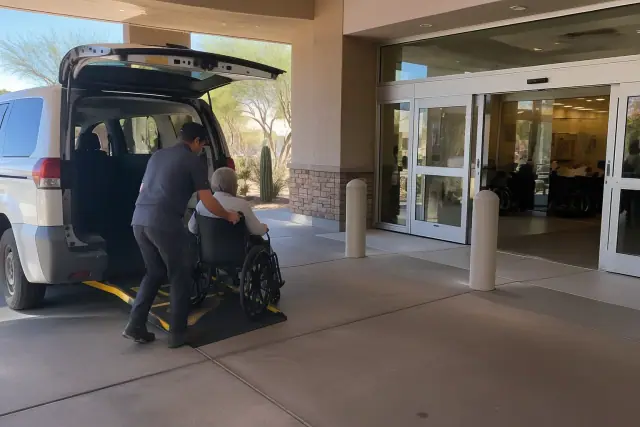 Wheelchair van boarding for a medical appointment at a building in Mesa, AZ.