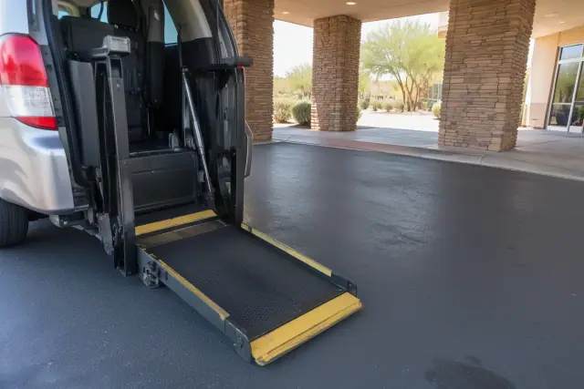 Wheelchair van lift at a Mesa, AZ medical office drop-off zone.
