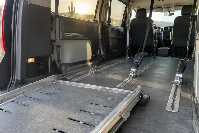 Wheelchair van ramp and passenger securement inside a transport vehicle in Mesa, AZ.