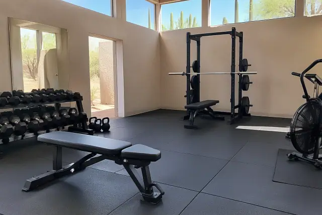 Interlocked rubber gym flooring installation in Mesa, AZ, showing cushioned anti-fatigue mats.