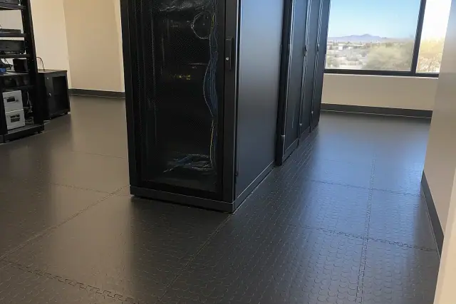 Anti-fatigue rubber flooring installed around server racks in a Tempe, AZ office.