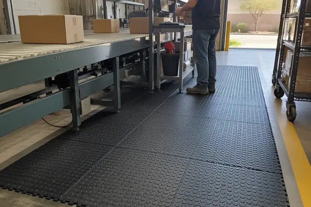 Anti-fatigue rubber flooring installed along a manufacturing workstation in Gilbert, AZ.