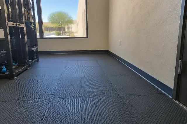 Anti-fatigue rubber flooring with interlocking seams and textured grip surface inside a Mesa, AZ facility.