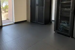 Interlocking anti-static rubber tiles installed near a window in Mesa, AZ.