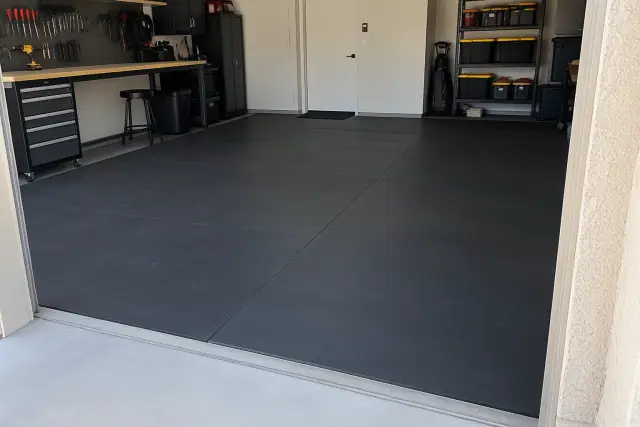 Heavy-duty rubber flooring installed over a concrete garage and workbench area in Gilbert, AZ.