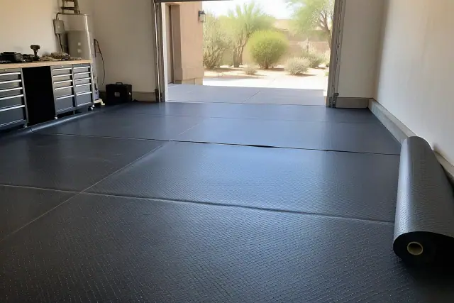 Thick black textured rubber flooring roll installed in a garage in Scottsdale, AZ.