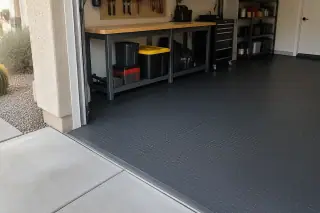 Protective rubber roll flooring covering a garage floor in Mesa, AZ.