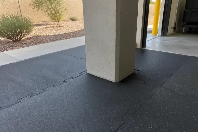 Completed industrial rubber flooring installation around a concrete column in Mesa, AZ.