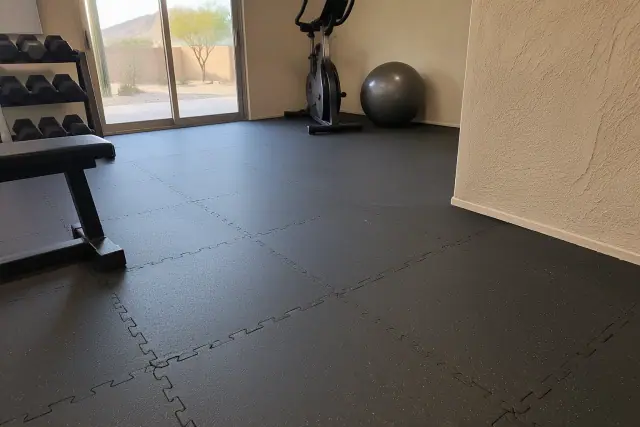 Interlocking rubber tiles installed on a residential basement floor in Mesa, AZ.