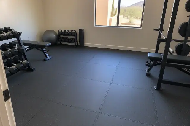 Interlocking rubber tiles installed in a residential basement home gym in Mesa, AZ.