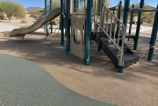 Playground rubber flooring repair and replacement at a recreation park in Mesa, AZ.