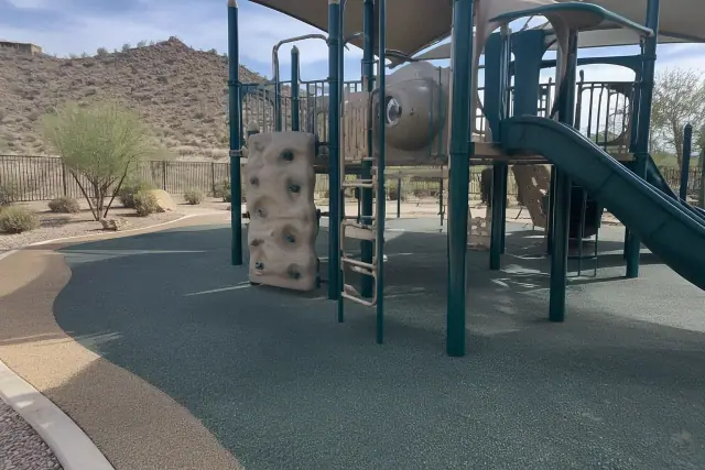 Poured-in-place rubber safety surfacing around a playground structure in Fountain Hills, AZ.