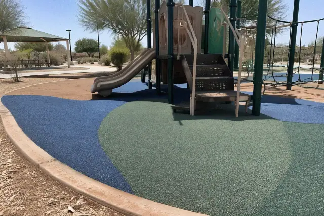Poured-in-place rubber safety flooring at a park playground in Mesa, AZ.