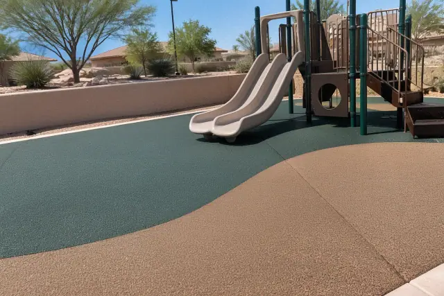 Completed rubber floor tile installation at a public park in Mesa, AZ, showing seamless impact-absorbing safety surfacing.
