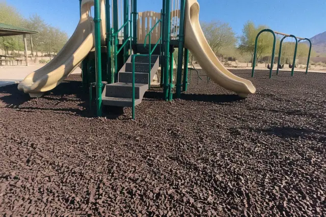 Recycled rubber mulch spread around a playground in Mesa, AZ.
