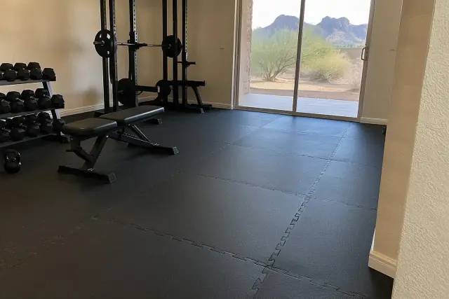 Rolled rubber and interlocking tiles installed in a residential home gym in Mesa, AZ.