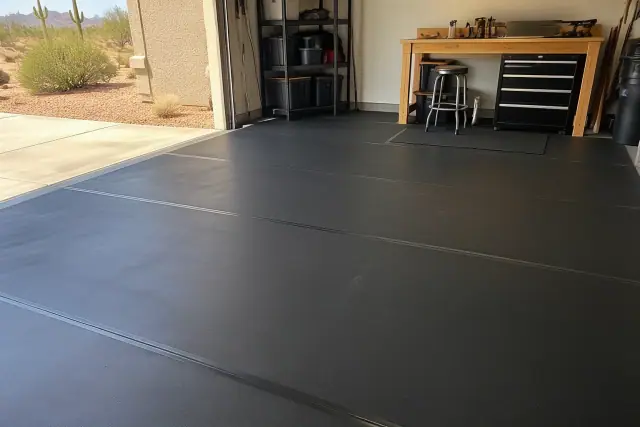 Black rolled rubber flooring installed on a garage concrete floor in Apache Junction, AZ.