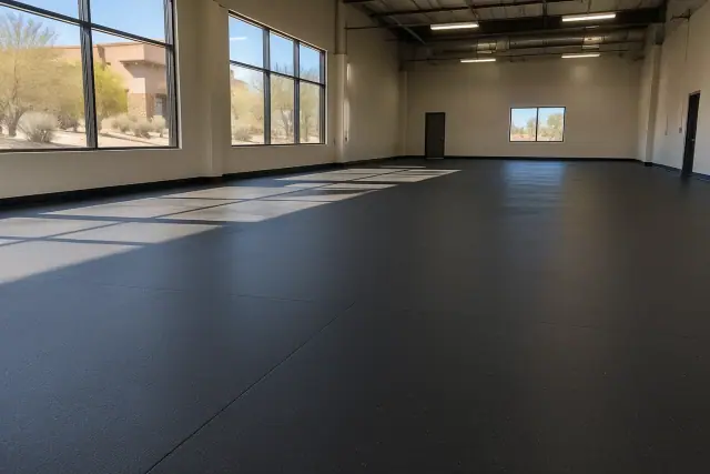 Black rolled rubber flooring installed in an indoor sports facility in Scottsdale, AZ.