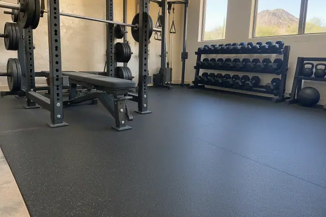 Rolled rubber flooring installed under barbell racks in Fountain Hills, AZ.