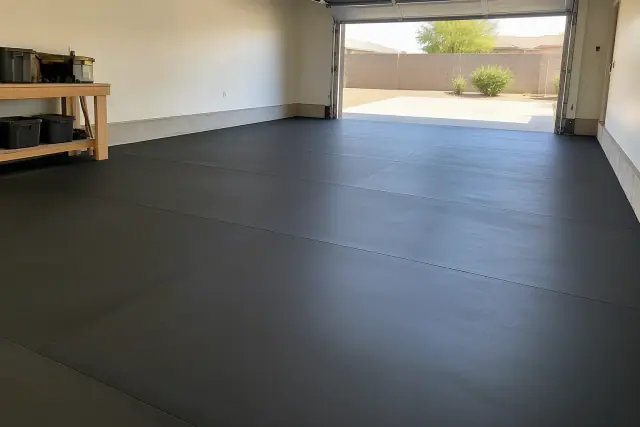 Rolled rubber flooring installed in a residential garage vehicle bay in Queen Creek, AZ.