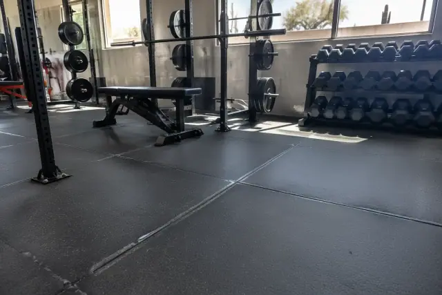 Rubber floor tile installation in a commercial fitness weightlifting zone in Mesa, AZ.