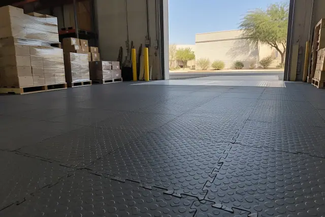 Commercial rubber flooring installed at a distribution facility in Mesa, AZ, showing heavy-duty texture.